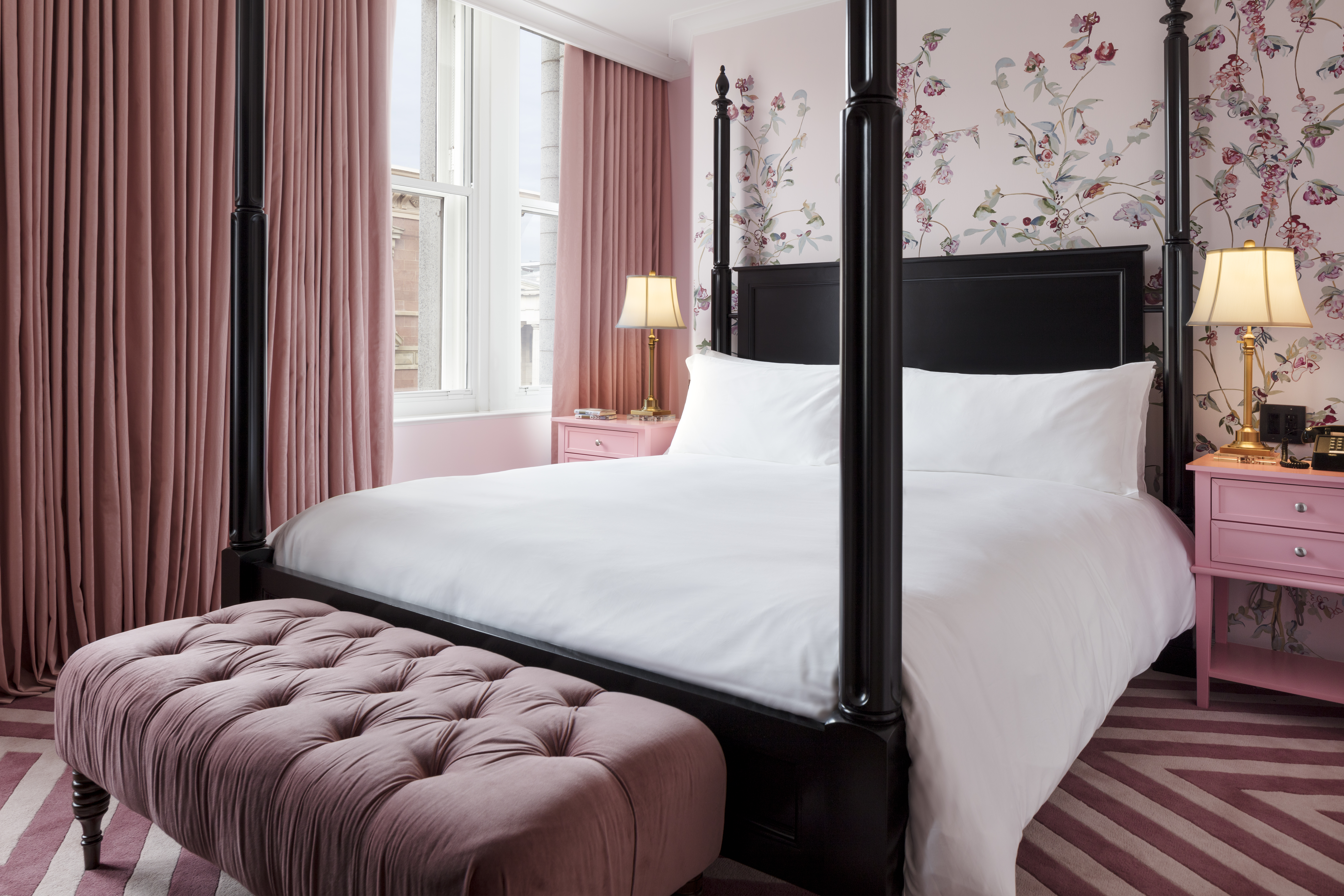 Louisa Adams bedroom with luxurious bedding.