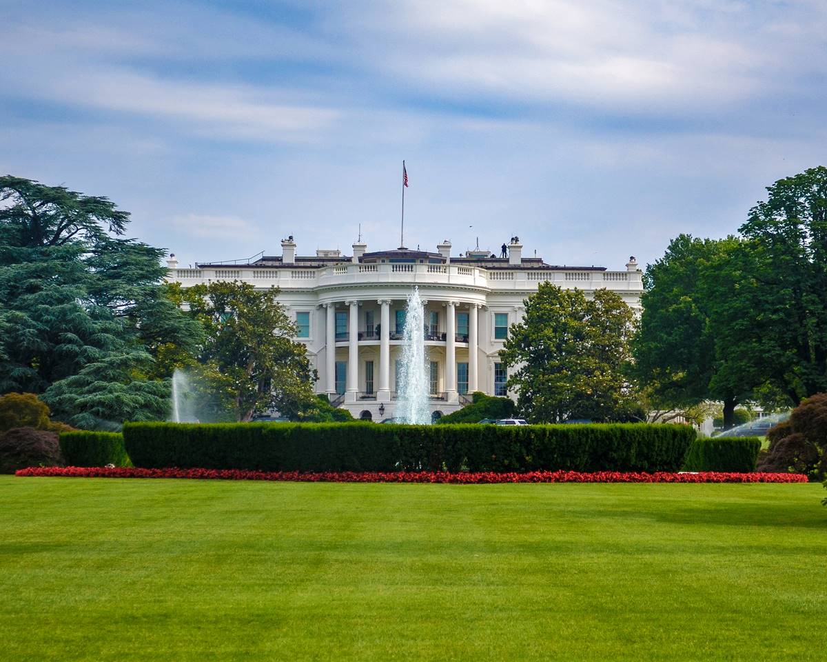 The White House, highlighting its iconic architecture and historical significance with a fountain in the front.