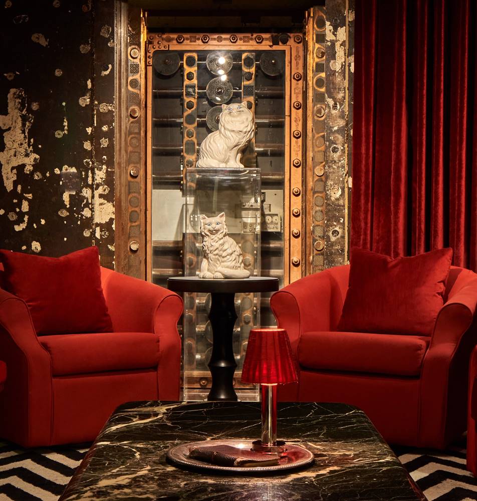 The vault area at Riggs DC, featuring red velvet accents, robust security doors and a historical ambiance.