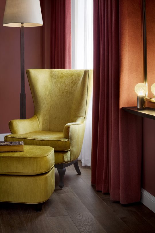 A cozy corner of the living room in the Atelier suite, featuring stylish decor and comfortable seating.