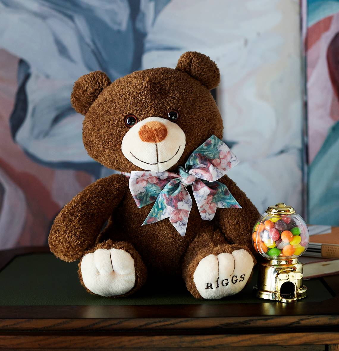 A family enjoying their stay at Riggs DC, showcasing a stuffed toy and candies for the young guests.