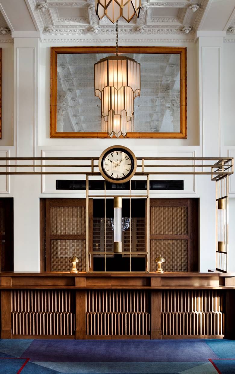 The reception desk at Riggs DC, with luxurious decor and artistic detailing.